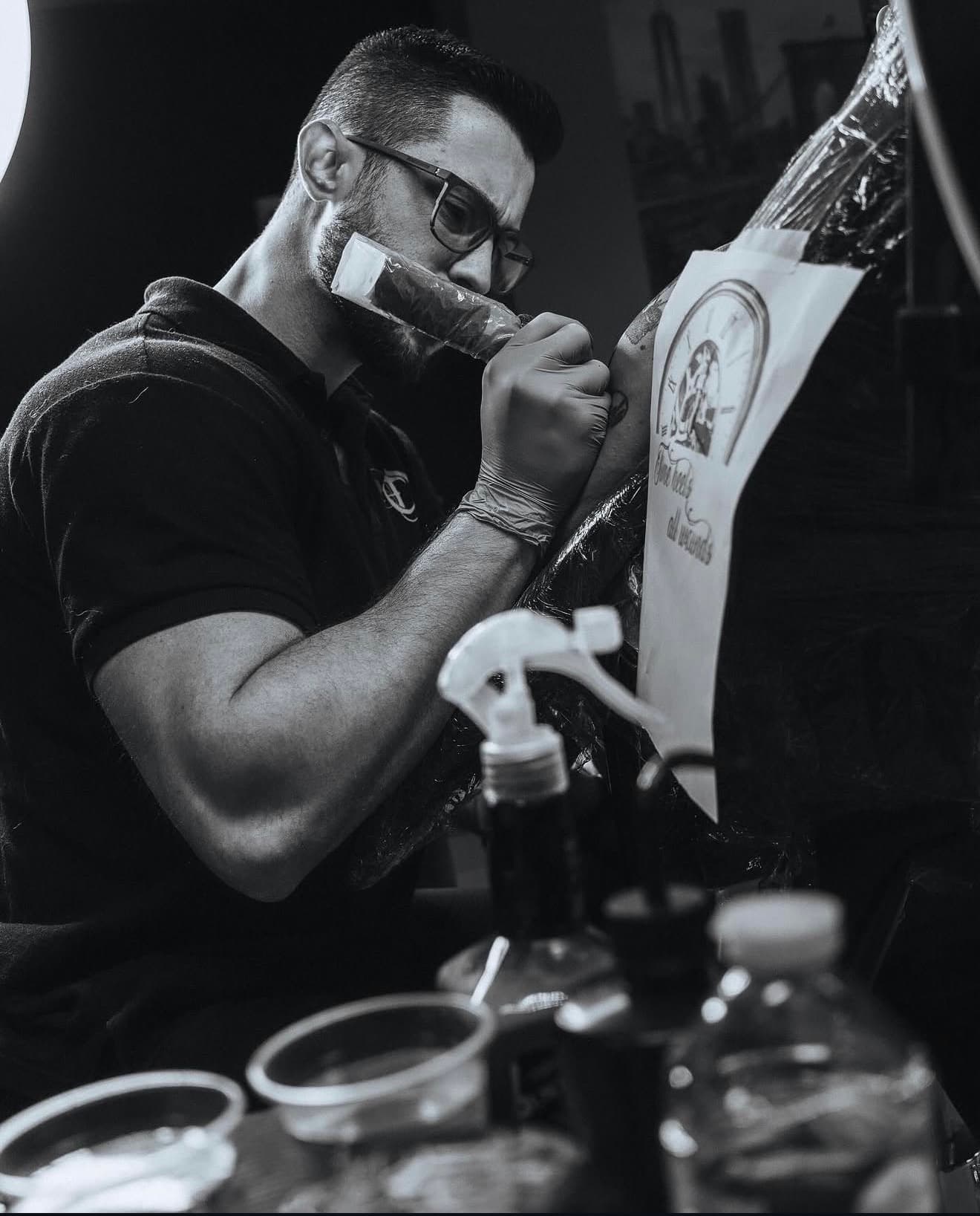 Tattoo artist at work at Cioffi Tattoo in Swindon
